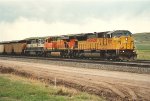 Loaded coal train rolls east